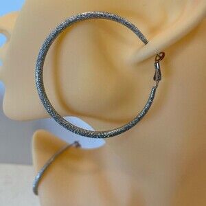 Silver Hoop Shimmer Earring’s 2” diameter Spring back closure